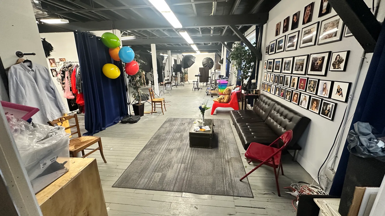 Photography Shark studio rental space at 83 E Water Street, Rockland MA — converted mill building interior with Godox strobe lighting and seamless backdrops
